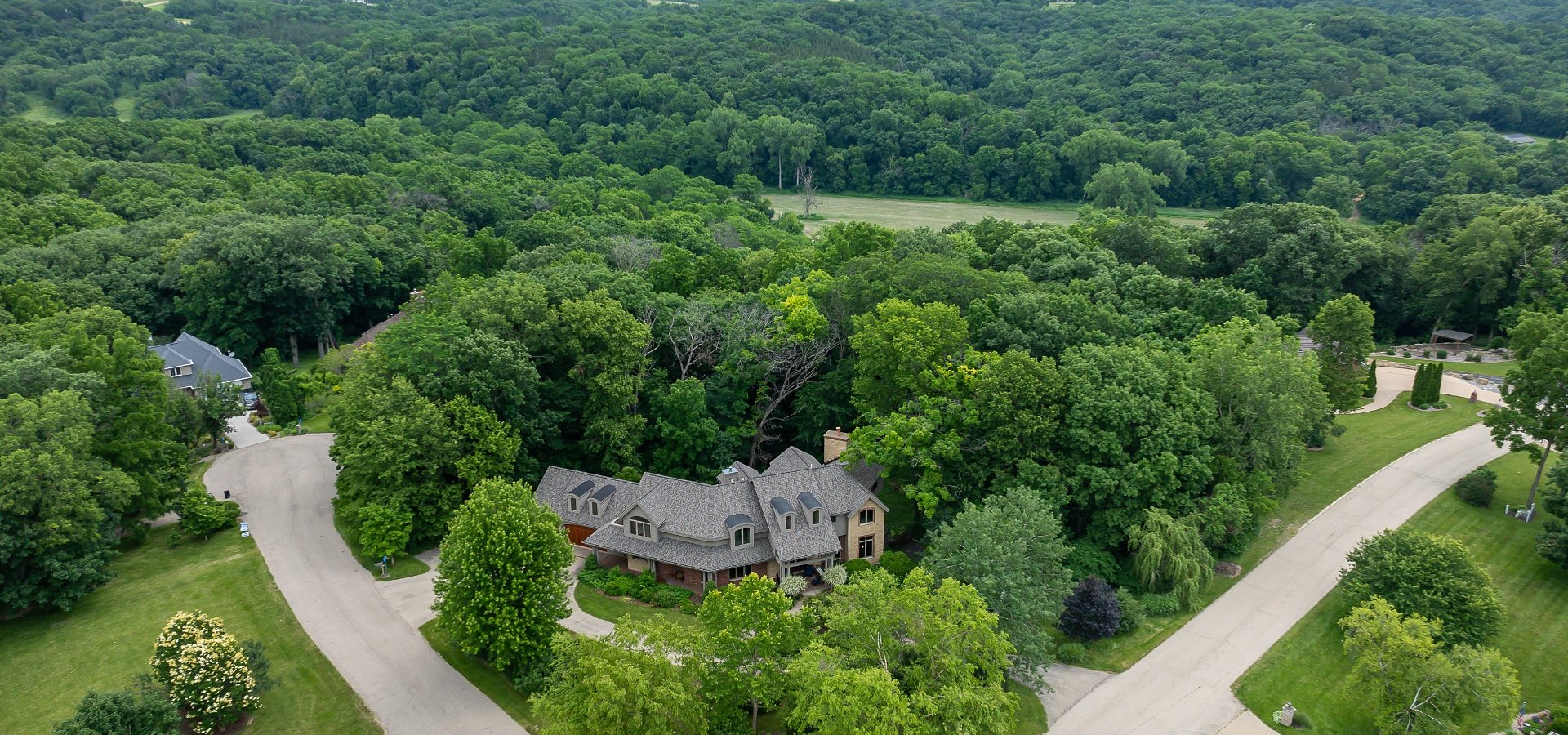 Aerial view of luxury home on wooded lot in East Dubuque — sold by Deb Hooks, Dubuque Realtor